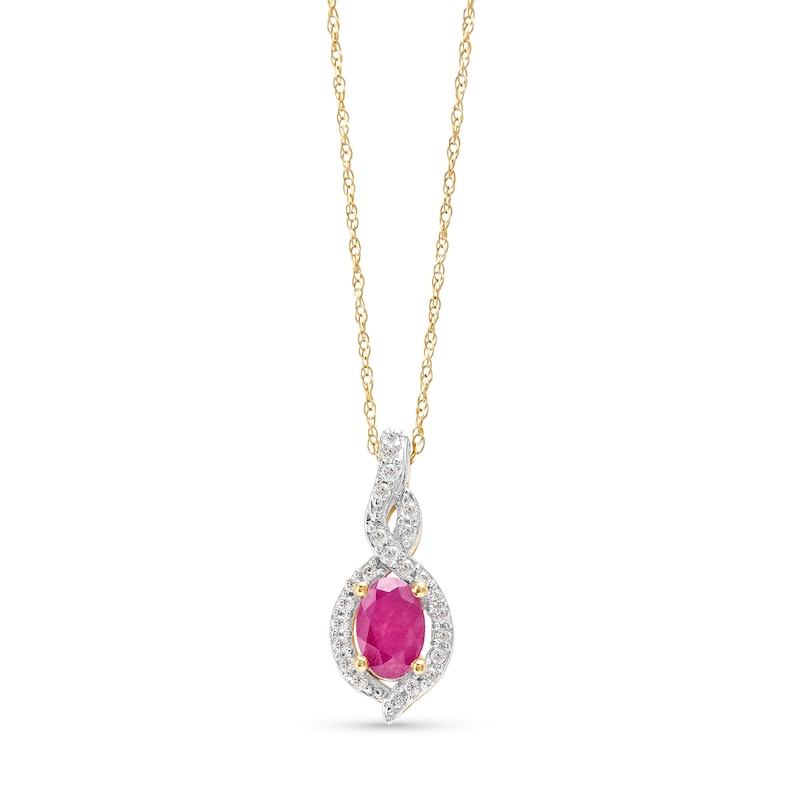 Main Image 1 of Oval-Shaped Ruby and 1/10 CT. T.W. Diamond Swirl Frame Pendant in 10K Gold