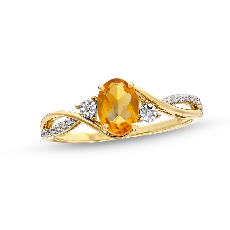 Oval Citrine and 1/20 CT. T.W. Diamond Twist Shank Ring in 10K Gold ...