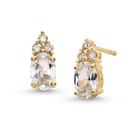 Oval White Lab-Created Sapphire and 1/10 CT. T.W. Diamond Stud Earrings in 10K Gold