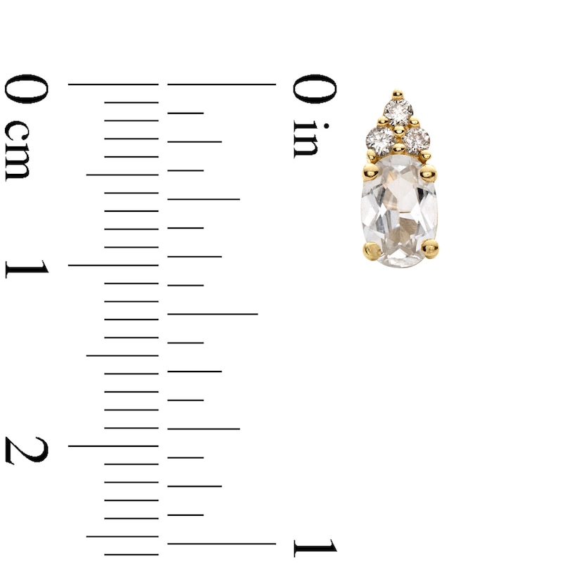 Main Image 3 of Oval White Lab-Created Sapphire and 1/10 CT. T.W. Diamond Stud Earrings in 10K Gold