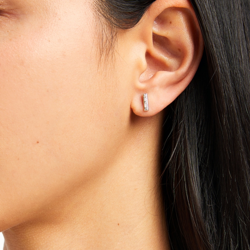 Main Image 2 of 1/10 CT. T.W. Baguette and Round Diamond Bar Stud Earrings in 10K White Gold