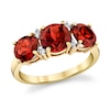 Thumbnail Image 1 of Garnet and 1/20 CT. T.W. Diamond Three Stone Ring in 14K Gold