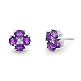 Oval Amethyst and 1/20 CT. T.W. Diamond Flower Stud Earrings in 14K White Gold