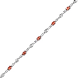 Oval Garnet and White Lab-Created Sapphire Bypass Link Alternating Bracelet in Sterling Silver - 7.25”