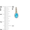 Thumbnail Image 3 of Oval Swiss Blue Topaz and White Lab-Created Sapphire Frame Drop Earrings in 10K Gold