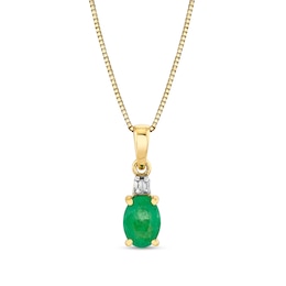 Oval Emerald and Baguette Diamond Accent Pendant in 10K Gold