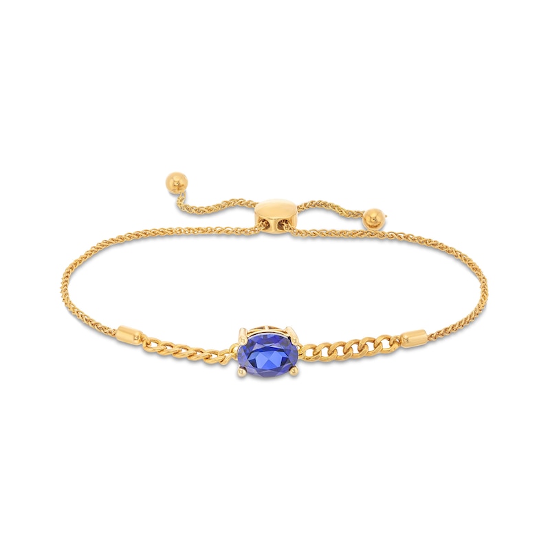 Main Image 1 of Sideways Oval Blue Lab-Created Sapphire Solitaire Cuban Curb Chain Bolo Bracelet in 10K Gold - 8.5"