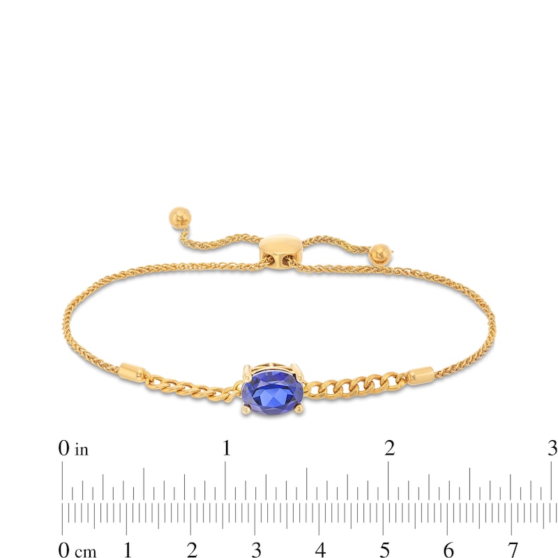Main Image 3 of Sideways Oval Blue Lab-Created Sapphire Solitaire Cuban Curb Chain Bolo Bracelet in 10K Gold - 8.5"