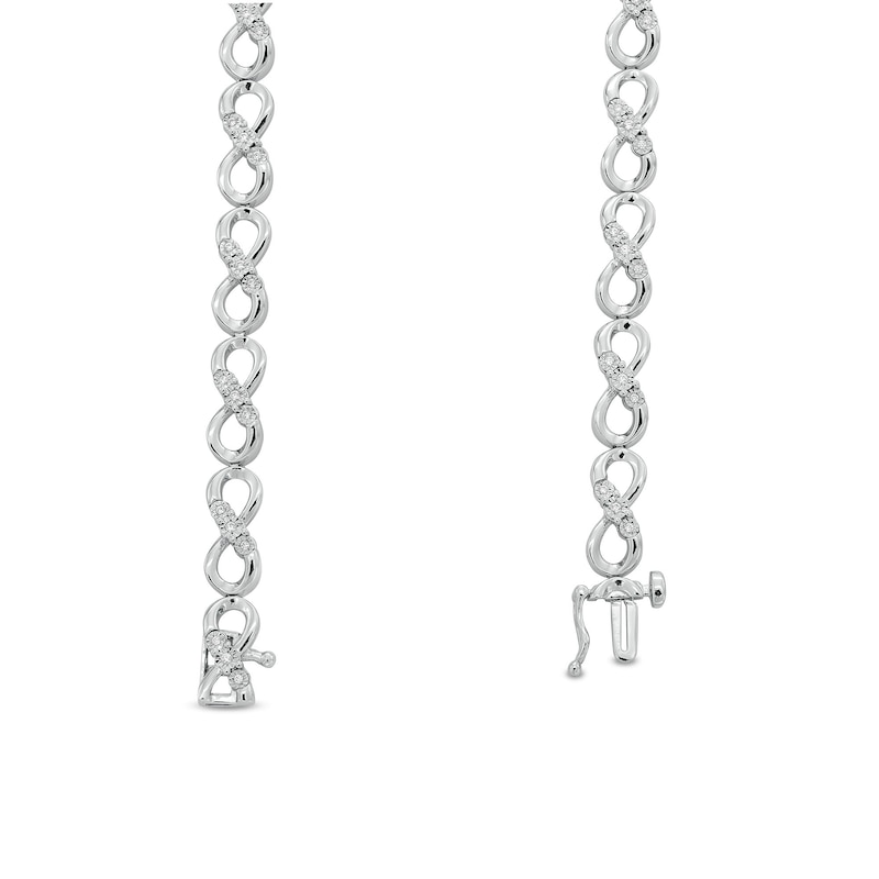 Main Image 3 of 1/6 CT. T.W. Diamond Miracle Three Stone Infinity Link Bracelet in Sterling Silver