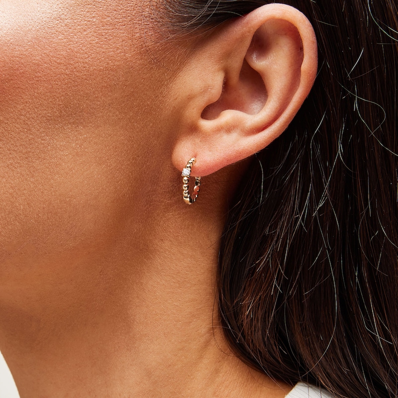 Main Image 2 of 1/8 CT. T.W. Diamond Solitaire Beaded Hoop Earrings in 10K Gold