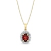 Thumbnail Image 1 of Oval Garnet and 1/8 CT. T.W. Diamond Swirl Frame Pendant in 10K Gold
