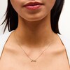 Thumbnail Image 2 of 1/10 CT. T.W. Diamond “love” Necklace in 10K Gold - 17”