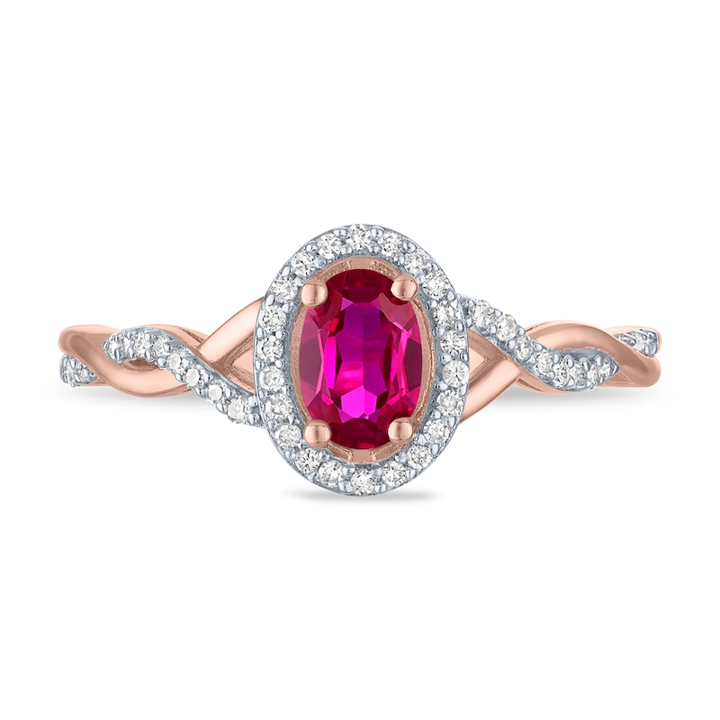 Main Image 1 of Oval Lab-Created Ruby and 1/8 CT. T.W. Diamond Frame Twist Shank Ring in Sterling Silver with 14K Gold Plate - Size 7