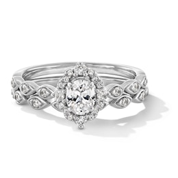 5/8 CT. T.W. Oval Certified Lab-Grown Diamond Frame Scallop Shank Bridal Set in 14K White Gold (F/VS2)
