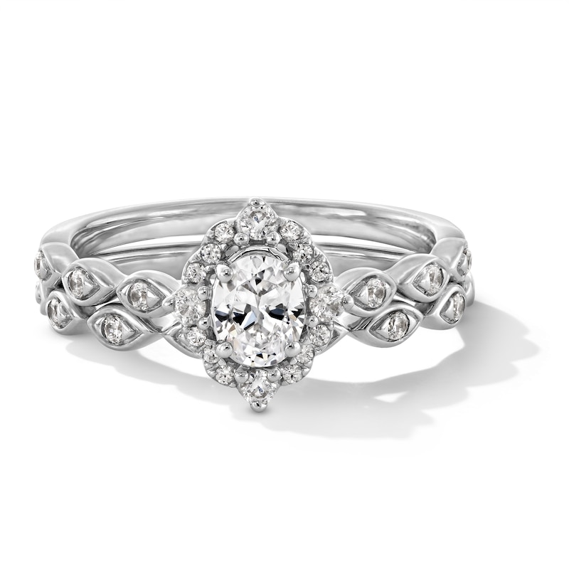 Main Image 1 of 5/8 CT. T.W. Oval Certified Lab-Grown Diamond Frame Scallop Shank Bridal Set in 14K White Gold (F/VS2)