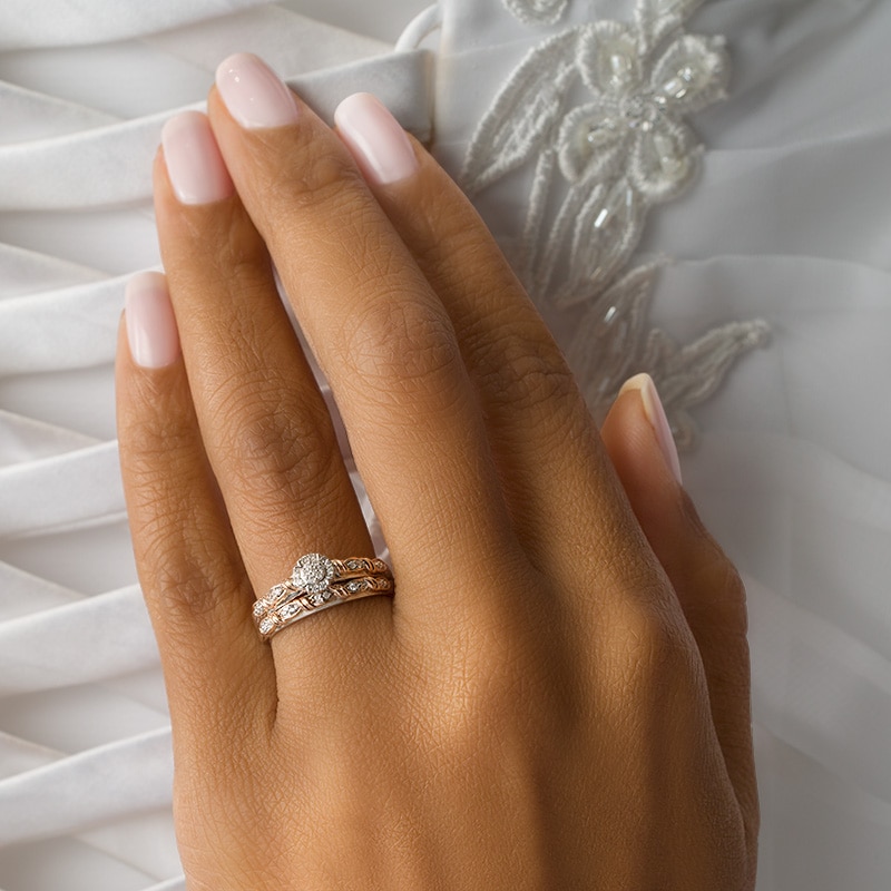 Main Image 3 of Previously Owned - 1/10 CT. T.W. Multi-Diamond Frame Twist Ribbon Interlocking Soldered Bridal Set in 10K Two-Tone Gold