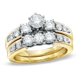 Previously Owned - 1-1/2 CT. T.W. Diamond Three Stone Soldered Bridal Set in 14K Gold