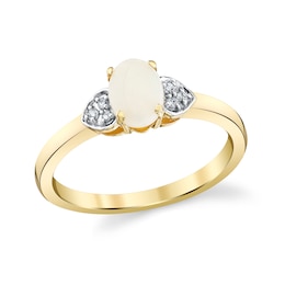 Oval Opal and 1/20 CT. T.W. Diamond Sides Fashion Ring in 10K Gold