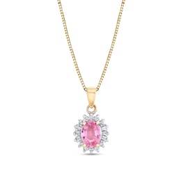 Oval Pink Sapphire and 1/5 CT. T.W. Diamond Starburst Frame Pendant in 10K Gold