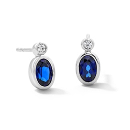 Oval Blue Lab-Created Sapphire and 1/20 CT. T.W. Lab-Grown Diamond Earrings in Sterling Silver (F/VS2)