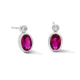 Oval Lab-Created Ruby and 1/20 CT. T.W. Lab-Grown Diamond Earrings in Sterling Silver (F/VS2)