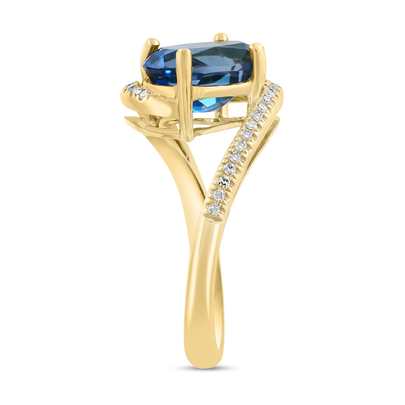 Main Image 3 of EFFY™ Oval London Blue Topaz and 1/8 CT. T.W. Diamond Bypass Ring in 14K Gold