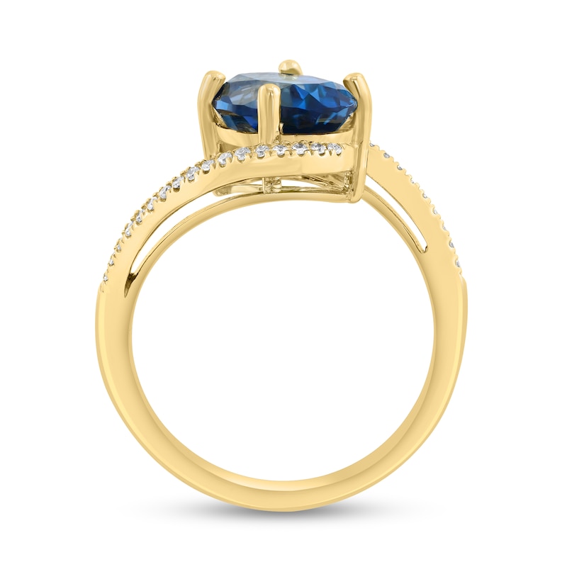 Main Image 4 of EFFY™ Oval London Blue Topaz and 1/8 CT. T.W. Diamond Bypass Ring in 14K Gold