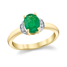 Oval Emerald and 1/20 CT. T.W. Diamond Ring in 10K Gold