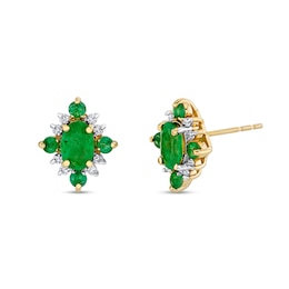 Oval Emerald and 1/8 CT. T.W. Diamond Starburst Frame Stud Earrings in 10K Gold