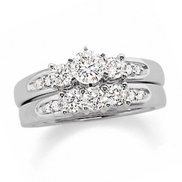 Previously Owned - 1-1/2 CT. T.W. Diamond Channel Three Stone Bridal Set in 14K White Gold