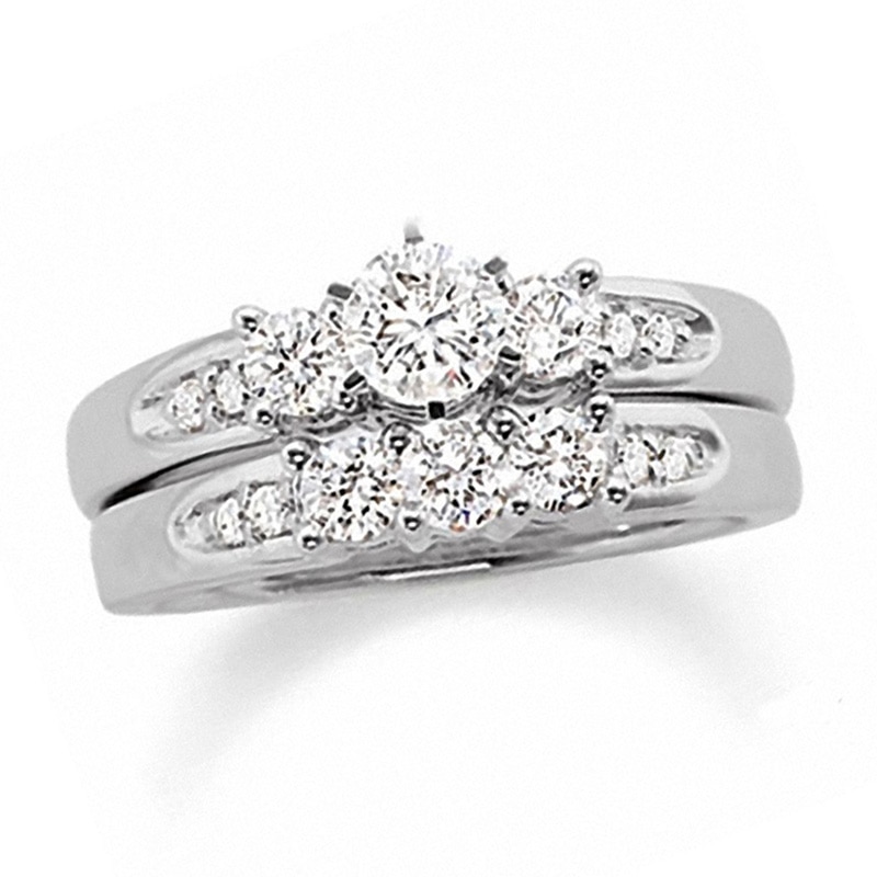 Previously Owned - 1-1/2 CT. T.W. Diamond Channel Three Stone Bridal Set in 14K White Gold