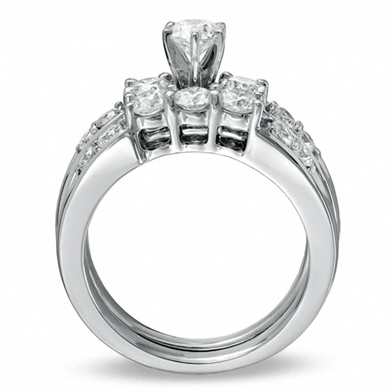 Previously Owned - 1-1/2 CT. T.W. Diamond Channel Three Stone Bridal Set in 14K White Gold