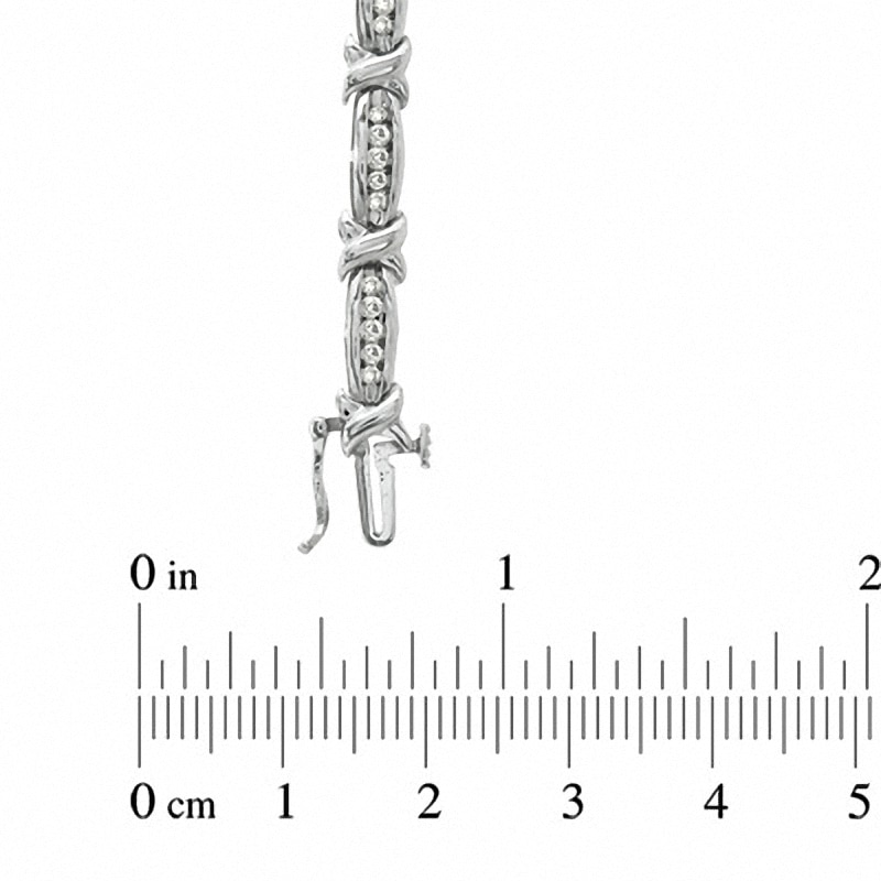 Main Image 3 of Previously Owned - 1 CT. T.W. Diamond Channel "X" Link Bracelet in 10K White Gold