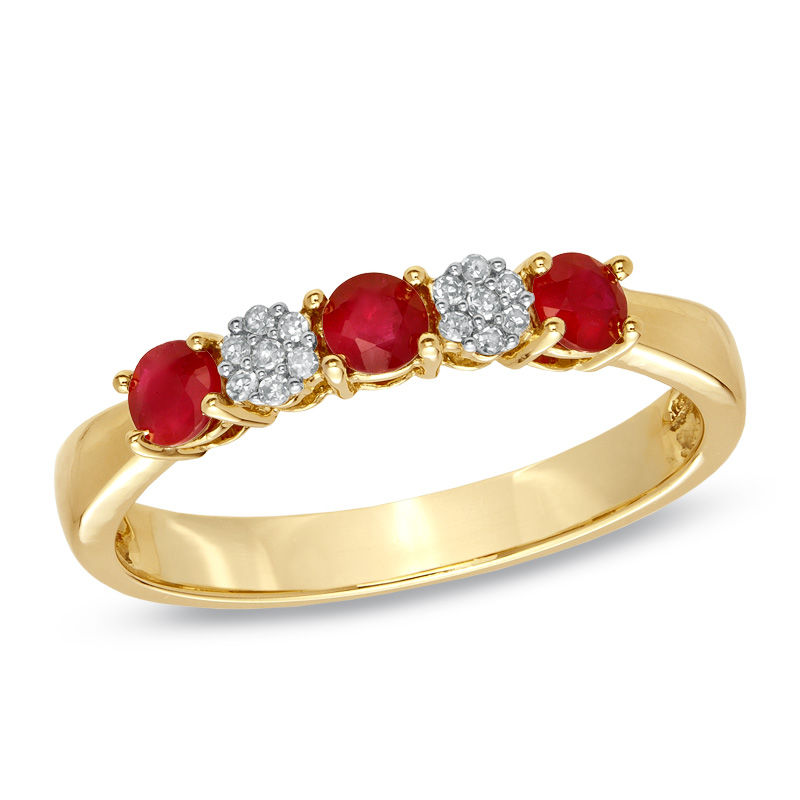 Previously Owned - Ruby and 1/20 CT. T.W. Diamond Three Stone Ring in 10K Gold