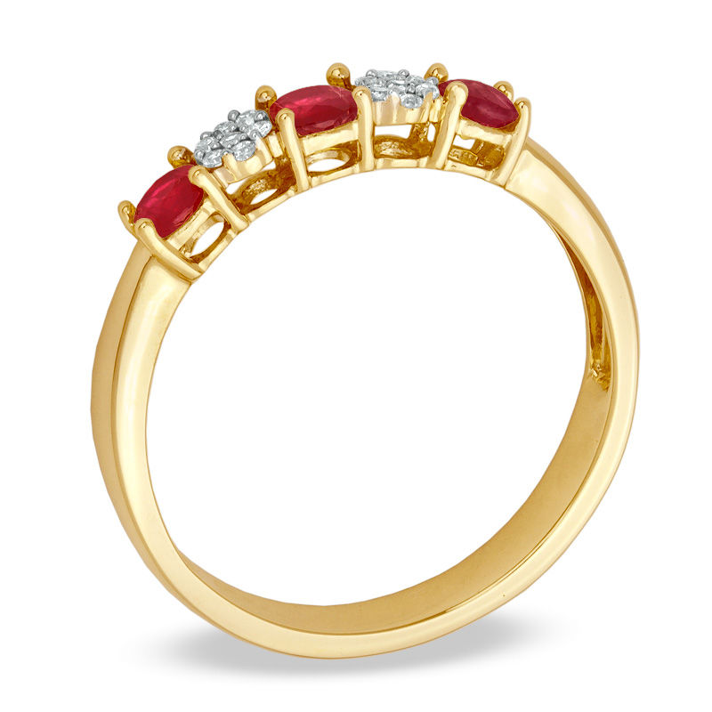 Previously Owned - Ruby and 1/20 CT. T.W. Diamond Three Stone Ring in 10K Gold