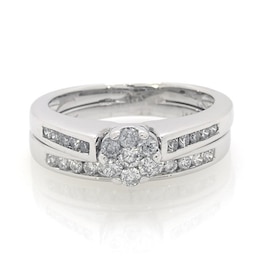 Previously Owned 1/2 CT. T.W. Diamond Flower Soldered Bridal Set in 10K White Gold