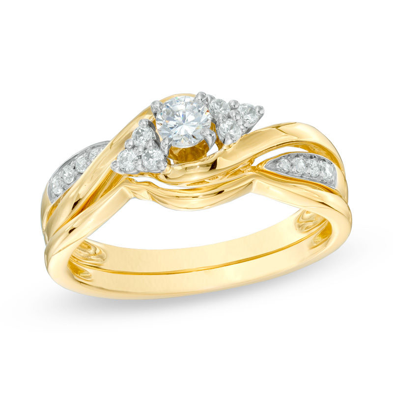 Main Image 1 of Previously Owned - 1/3 CT. T.W. Diamond Twist Shank Bridal Set in 10K Gold