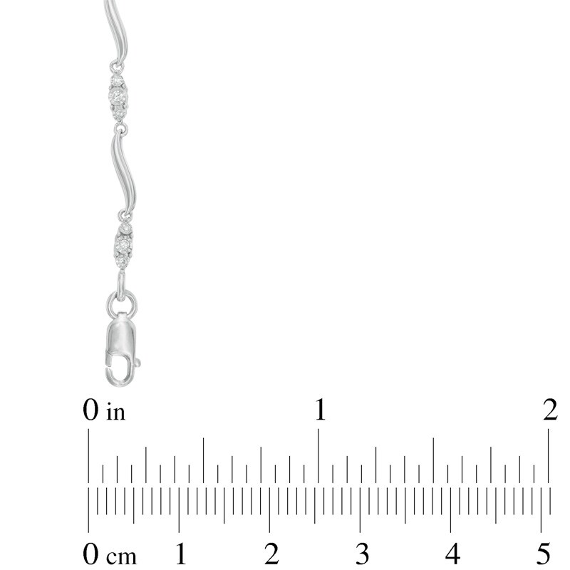 Main Image 2 of Previously Owned - 1/8 CT. T.W. Diamond Three Stone Curved Station Bracelet in 10K White Gold
