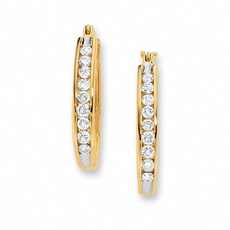 Previously Owned - 1/4 CT. T.W. Channel-Set Diamond Oval Hoop Earrings in 14K Gold
