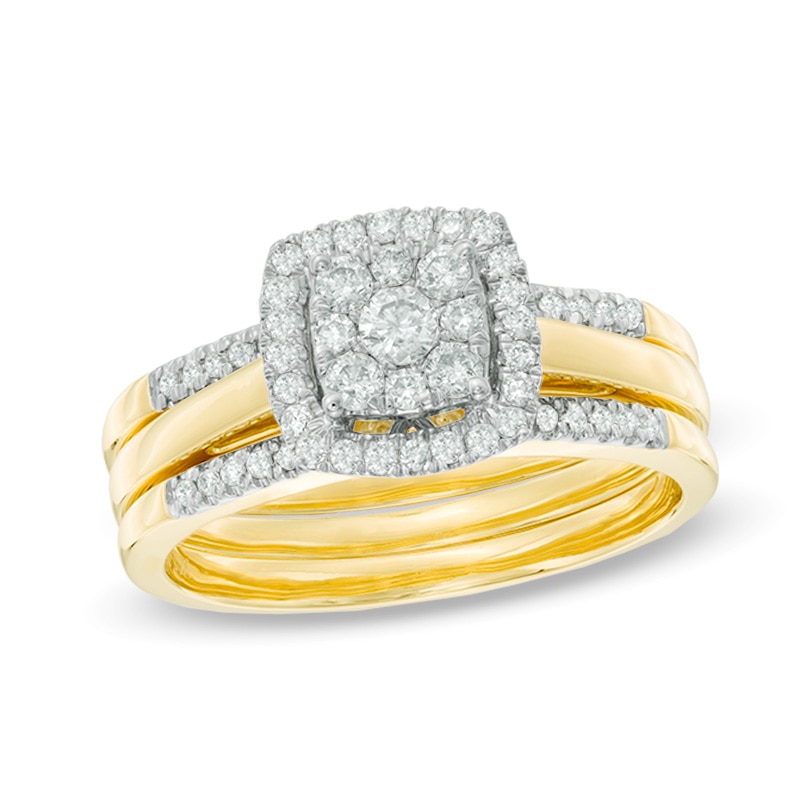 Previously Owned - 1/2 CT. T.W. Diamond Cluster Frame Three Piece Bridal Set in 10K Gold