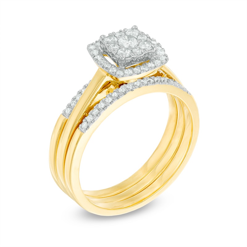 Previously Owned - 1/2 CT. T.W. Diamond Cluster Frame Three Piece Bridal Set in 10K Gold