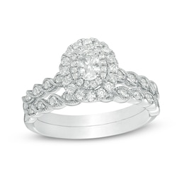 Previously Owned - 3/4 CT. T.W. Oval Diamond Double Frame Twist Vintage-Style Bridal Set in 14K White Gold