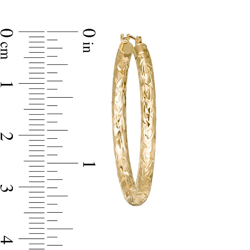 Previously Owned - Diamond-Cut Oval Tube Hoop Earrings in 14K Gold