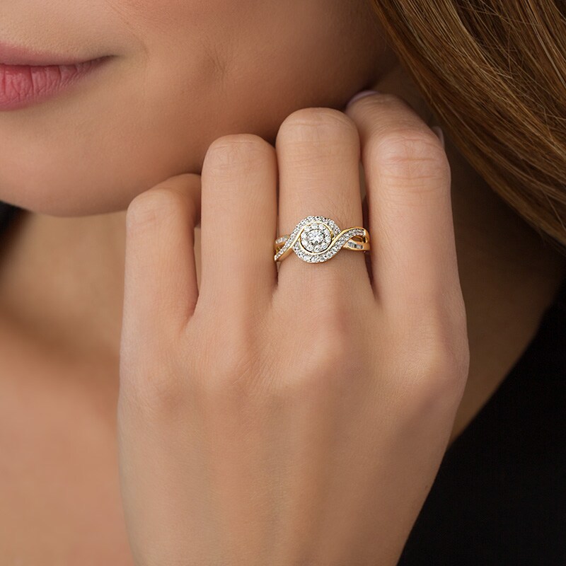Previously Owned - 1/2 CT. T.W. Diamond Frame Swirl Bypass Ring in 10K Gold