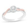 Thumbnail Image 1 of Previously Owned - 1/8 CT. T.W. Diamond Frame Twist Shank Promise Ring in Sterling Silver and 10K Rose Gold