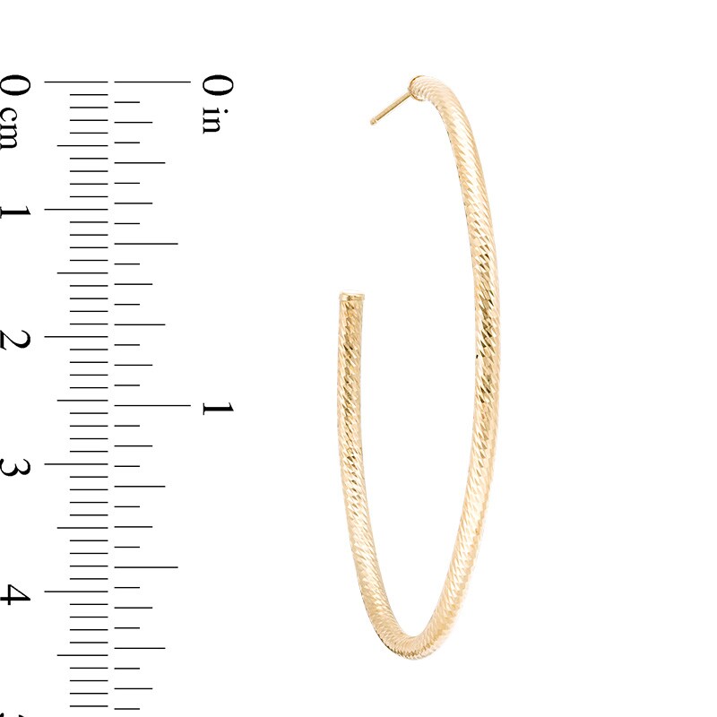 Previously Owned - Diamond-Cut Oval Hoop Earrings in 14K Gold