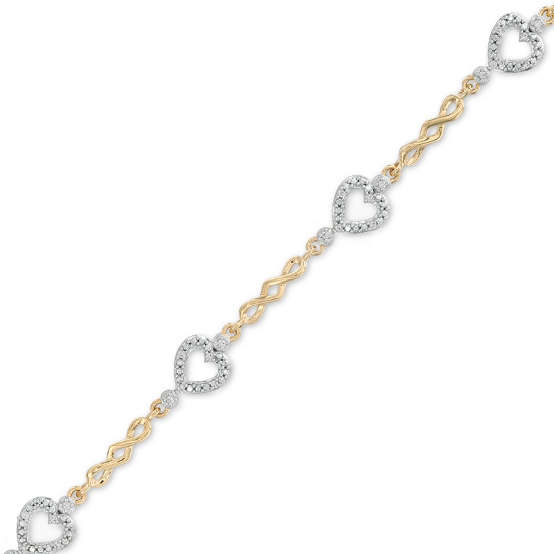 Previously Owned - 1/10 CT. T.W. Diamond Sideways Heart Station Twist Bracelet in 10K Gold - 7.5"