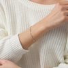 Thumbnail Image 1 of Previously Owned - 1/10 CT. T.W. Diamond Sideways Heart Station Twist Bracelet in 10K Gold - 7.5"