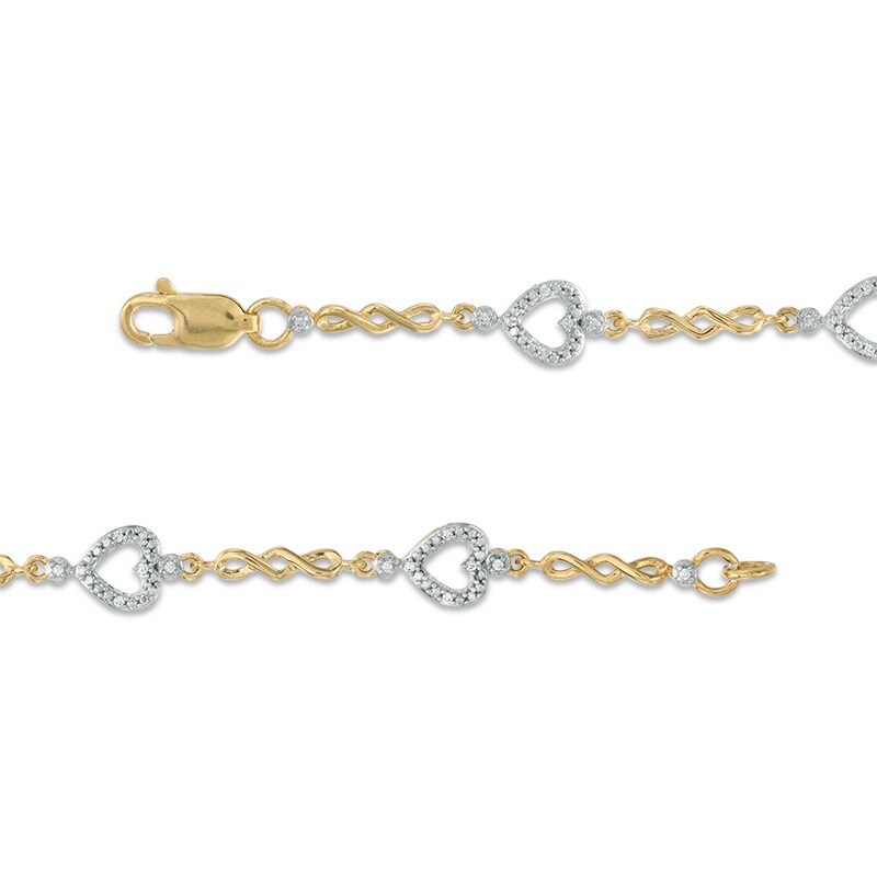 Previously Owned - 1/10 CT. T.W. Diamond Sideways Heart Station Twist Bracelet in 10K Gold - 7.5"