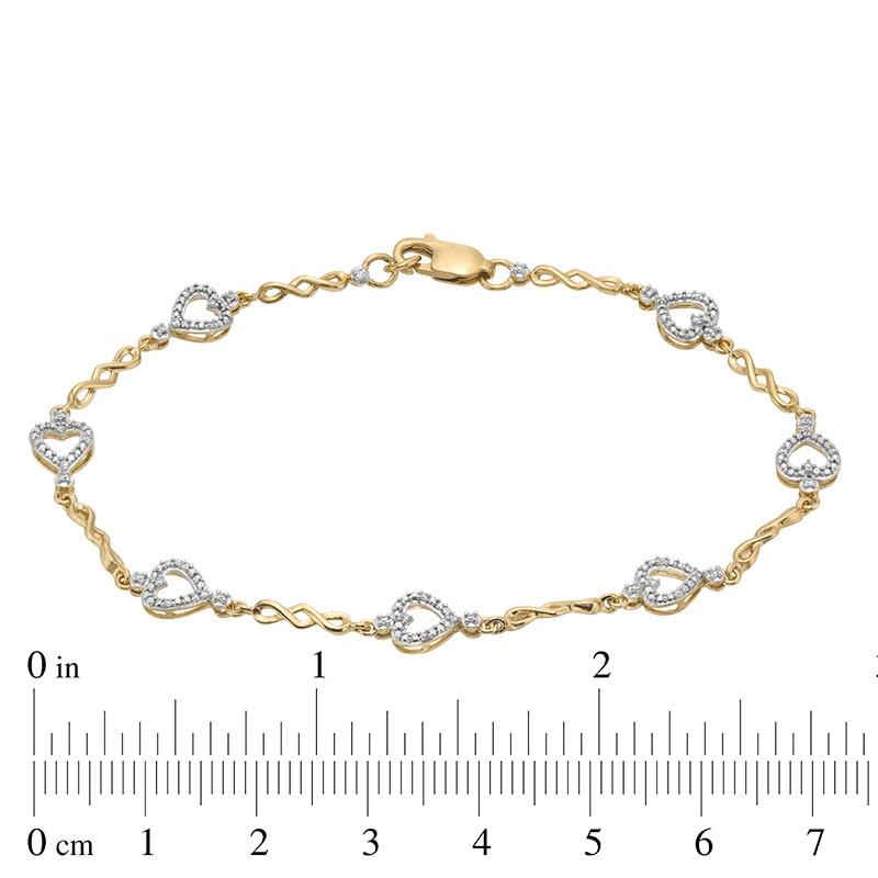 Previously Owned - 1/10 CT. T.W. Diamond Sideways Heart Station Twist Bracelet in 10K Gold - 7.5"